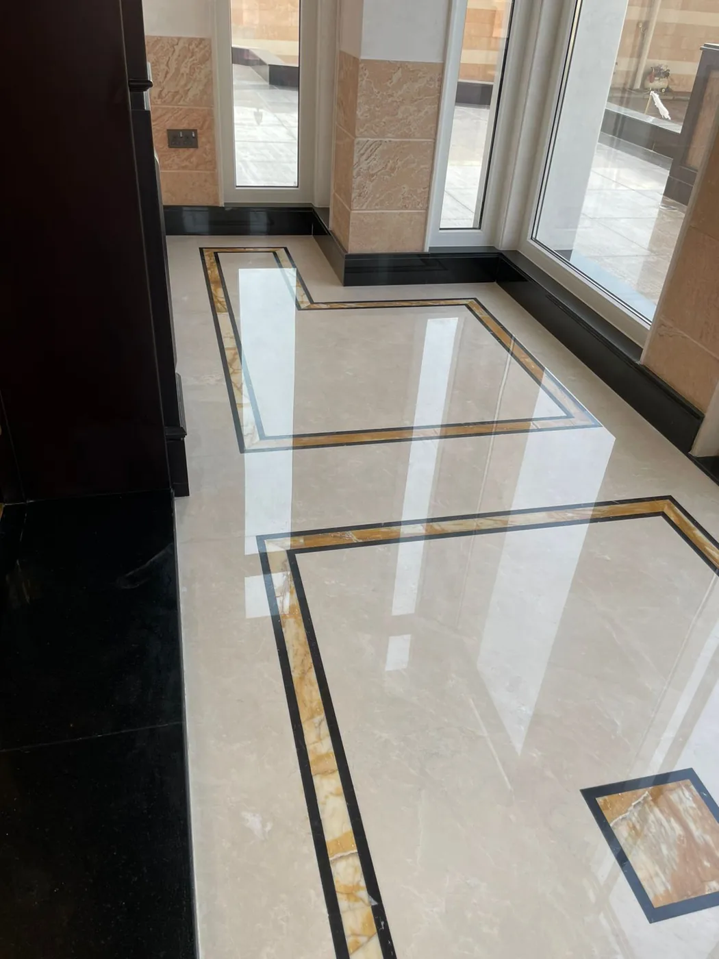 Decorative marble medallion inlay polished to a mirror finish by MarblePro — luxury villa entrance in Dubai, UAE