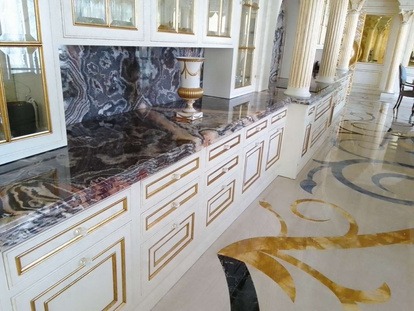 Fusion WOW quartz countertop polishing by MarblePro — dramatic veining pattern restored on luxury villa kitchen island, Dubai