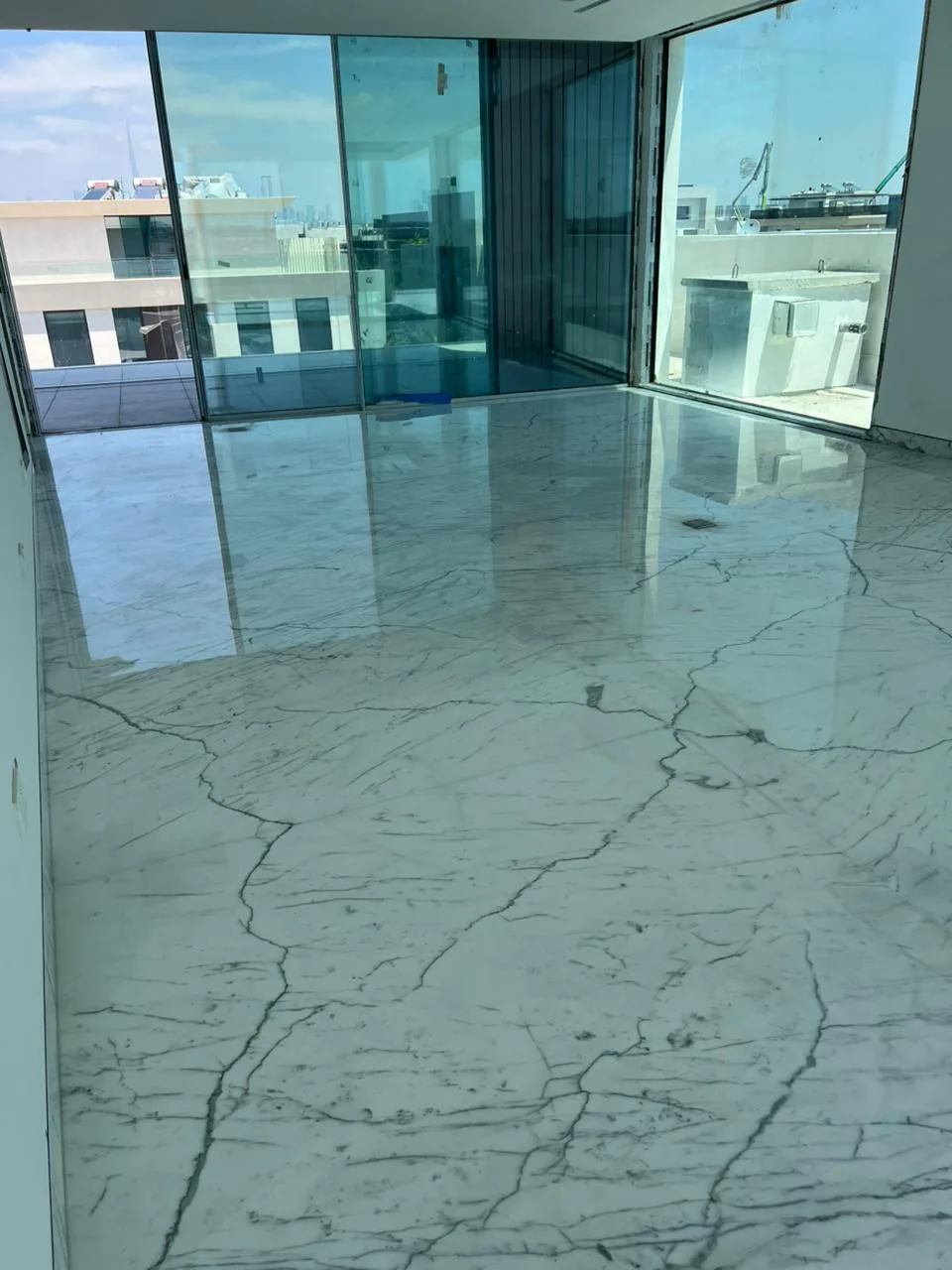Polished marble floor restored to a high-gloss mirror finish by MarblePro — real villa project in Dubai, UAE