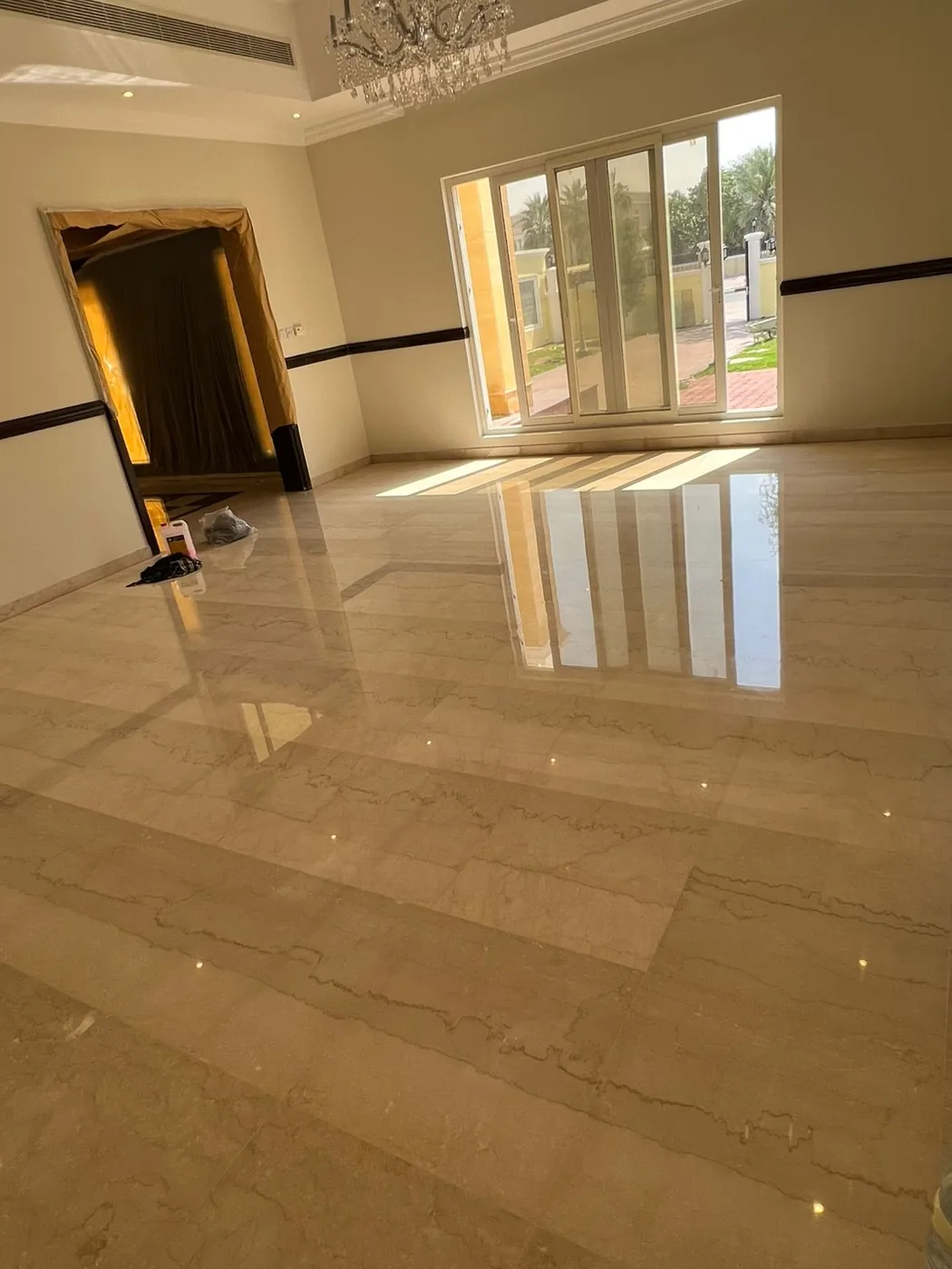 Polished marble floor restored to a high-gloss mirror finish by MarblePro — real villa project in Dubai, UAE