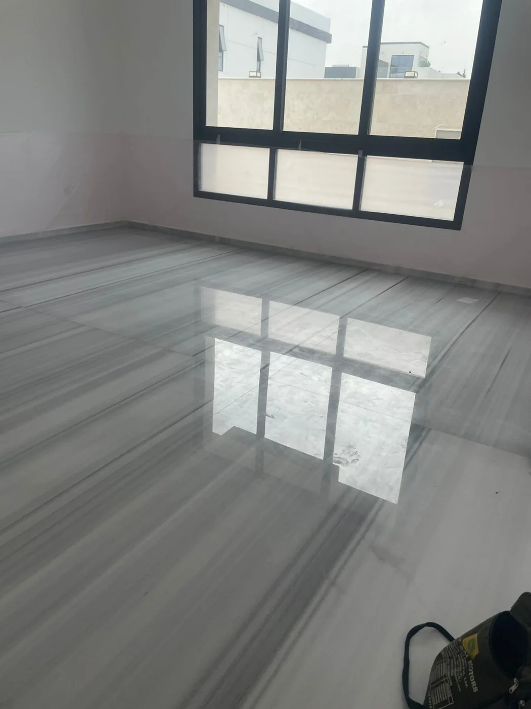 Polished marble floor restored to a high-gloss mirror finish by MarblePro — real villa project in Dubai, UAE