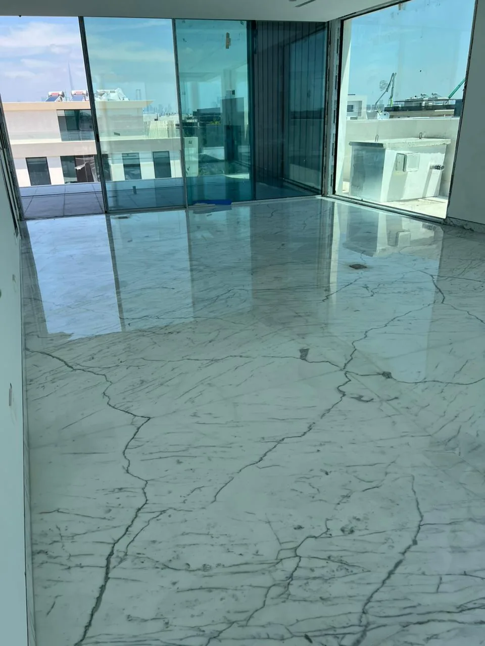 Polished marble floor restored to a high-gloss mirror finish by MarblePro — real villa project in Dubai, UAE