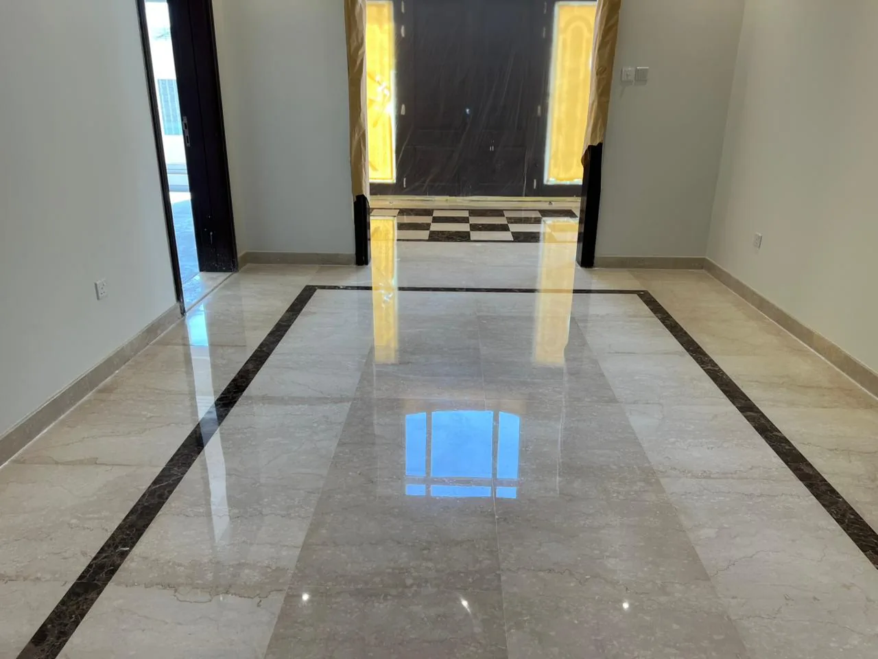 Polished marble floor restored to a high-gloss mirror finish by MarblePro — real villa project in Dubai, UAE