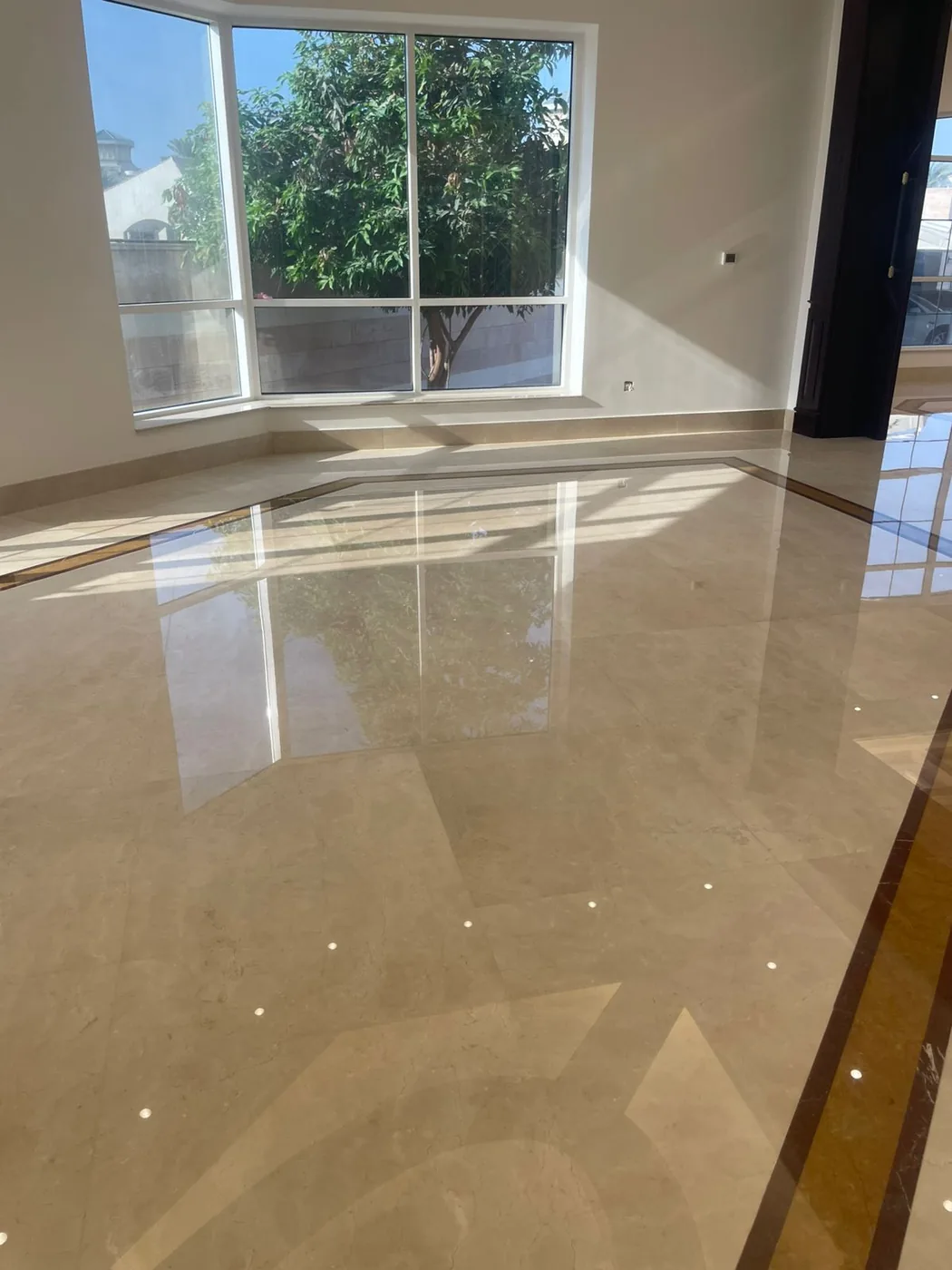 Polished marble floor restored to a high-gloss mirror finish by MarblePro — real villa project in Dubai, UAE