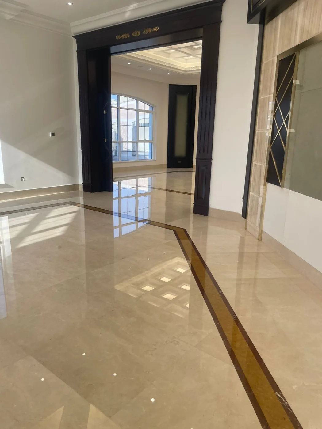 Polished marble floor restored to a high-gloss mirror finish by MarblePro — real villa project in Dubai, UAE